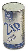 ZIP a.k.a. ZAM Buffing Compound sold as a one pound cylinder (List Price $9.95) a must for any bench, allowing you to polish most all metals, or softer stones, epoxies and plastics to a final high luster with no residue.  Initial surfaces should be prepared with Tripoli or White diamond.  Use with tight-weave muslin wheels.  Mildly abrasive.
